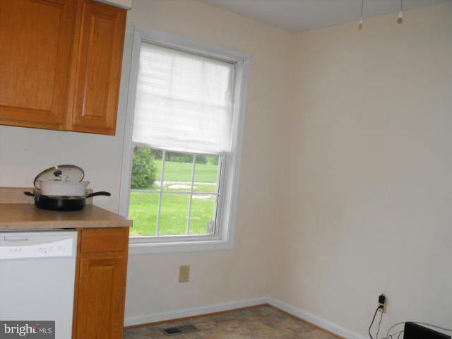 145 Cove Point Road Lusby, MD 20657 - Photo 6 of 13 a kitchen with a sink and a window