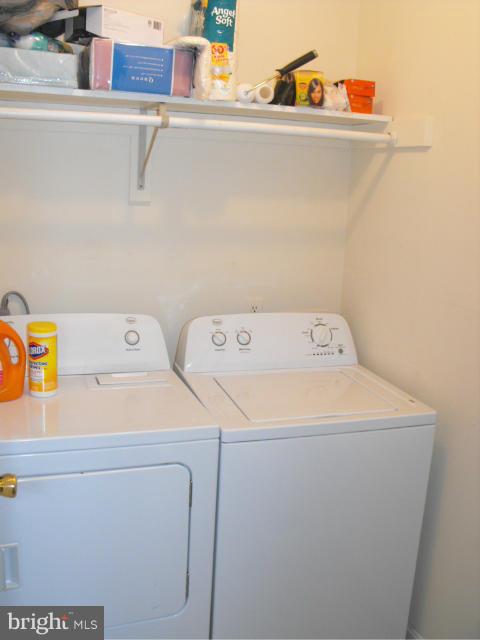 145 Cove Point Road Lusby, MD 20657 - Photo 10 of 13 a utility room with dryer and washer