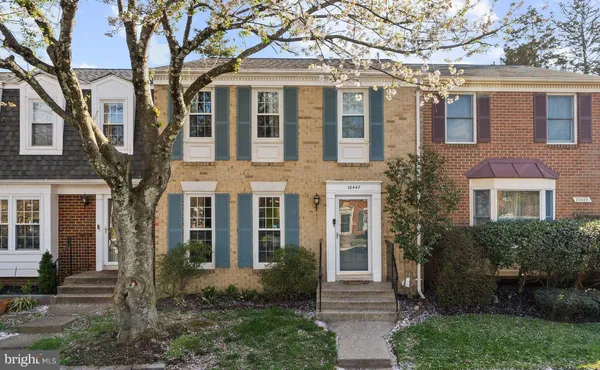 a view of a patio with a fire pit and chairs