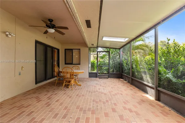 an aerial view of a house with yard swimming pool and outdoor seating