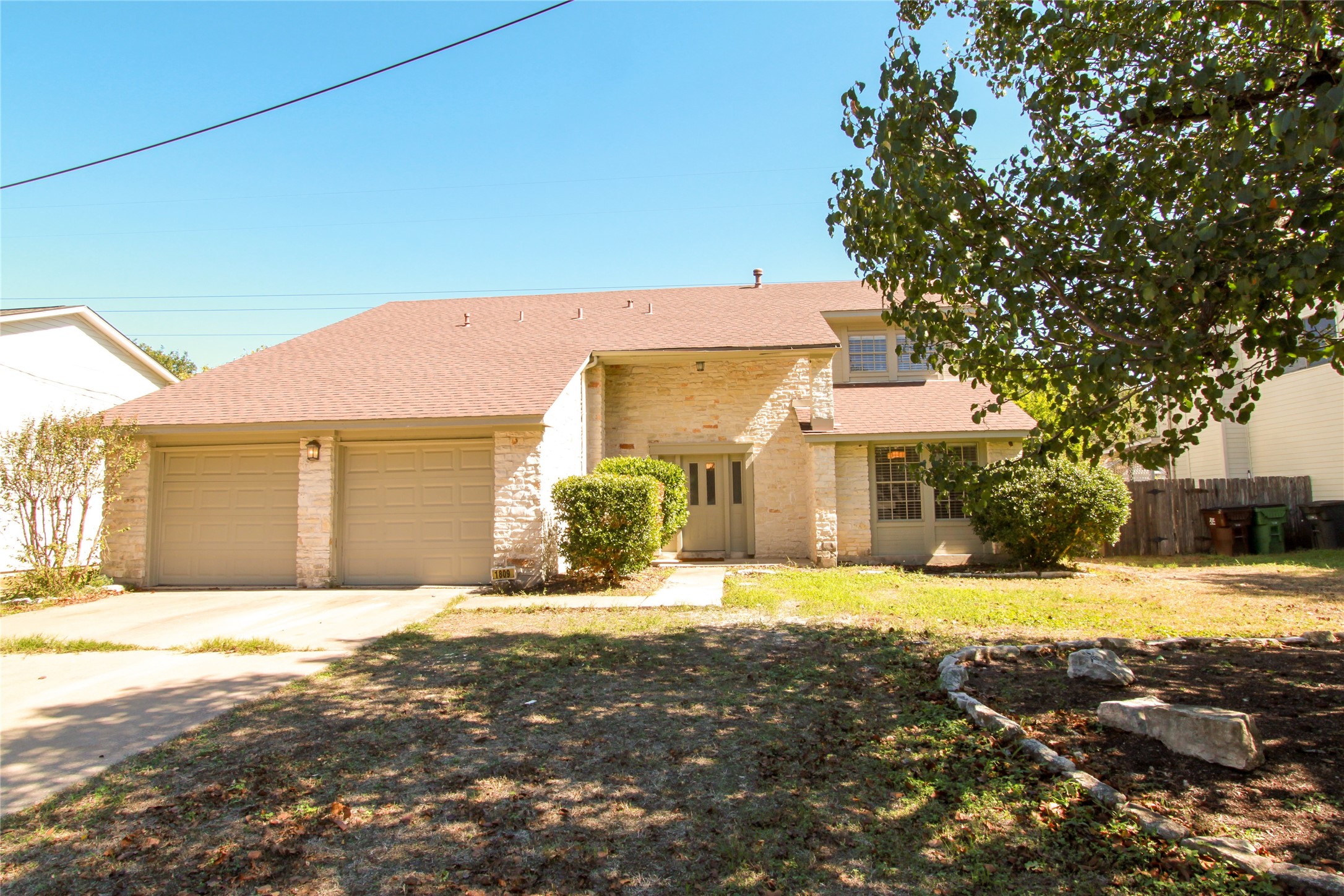 1809 Fawn Ridge Trail Round Rock, TX 78681 - Photo 1 of 1 A classic brick and siding residence features a two-car garage and established front landscaping.