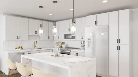 a kitchen with a sink a center island and cabinets
