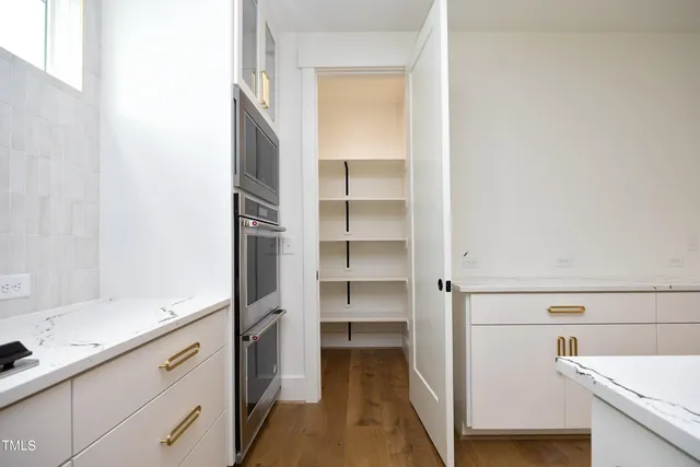 a kitchen with a refrigerator and a sink