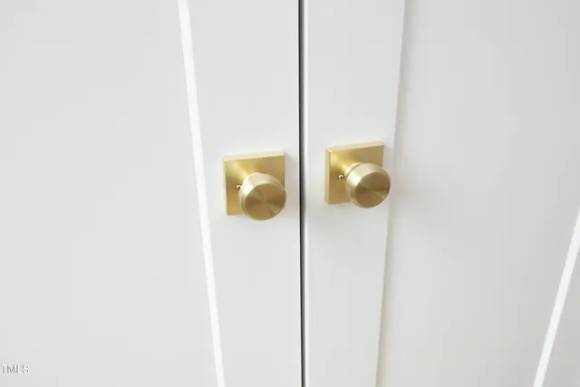 a bathroom with a mirror and vanity