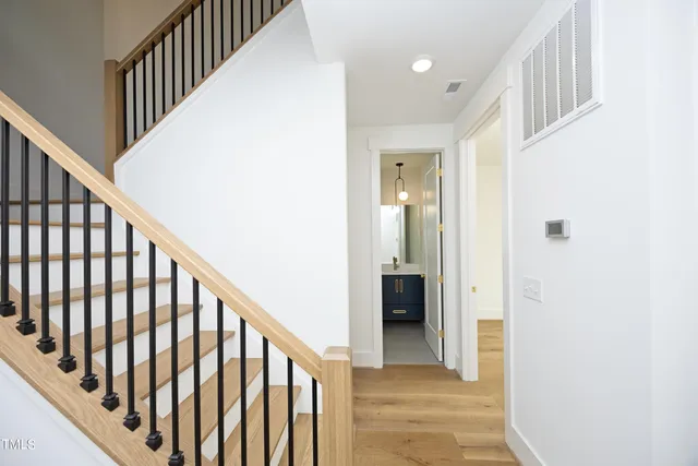 a view of staircase with lots of wooden floor