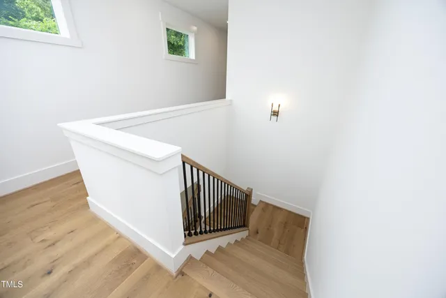 a view of a hallway with staircase