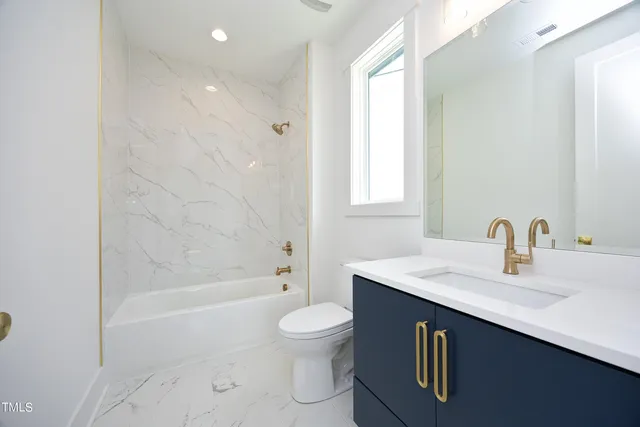 a bathroom with a sink a toilet and a bathtub