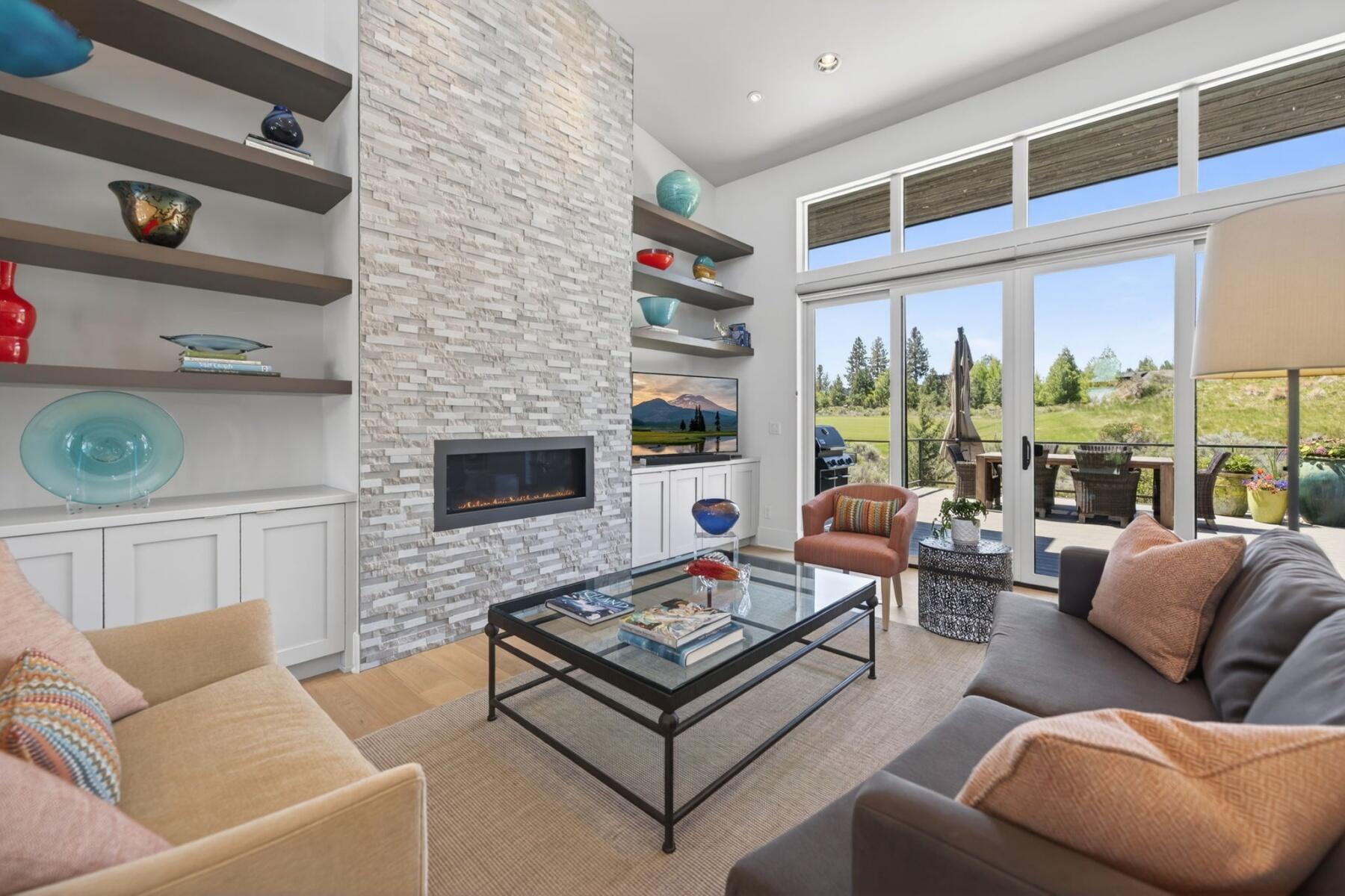 61487 Hackleman Court Bend, OR 97702 - Photo 7 of 35 a living room with furniture and a fireplace