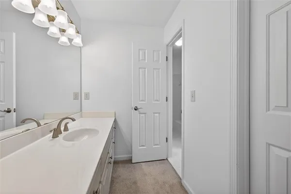 a large spacious bathroom with a large tub shower and sink