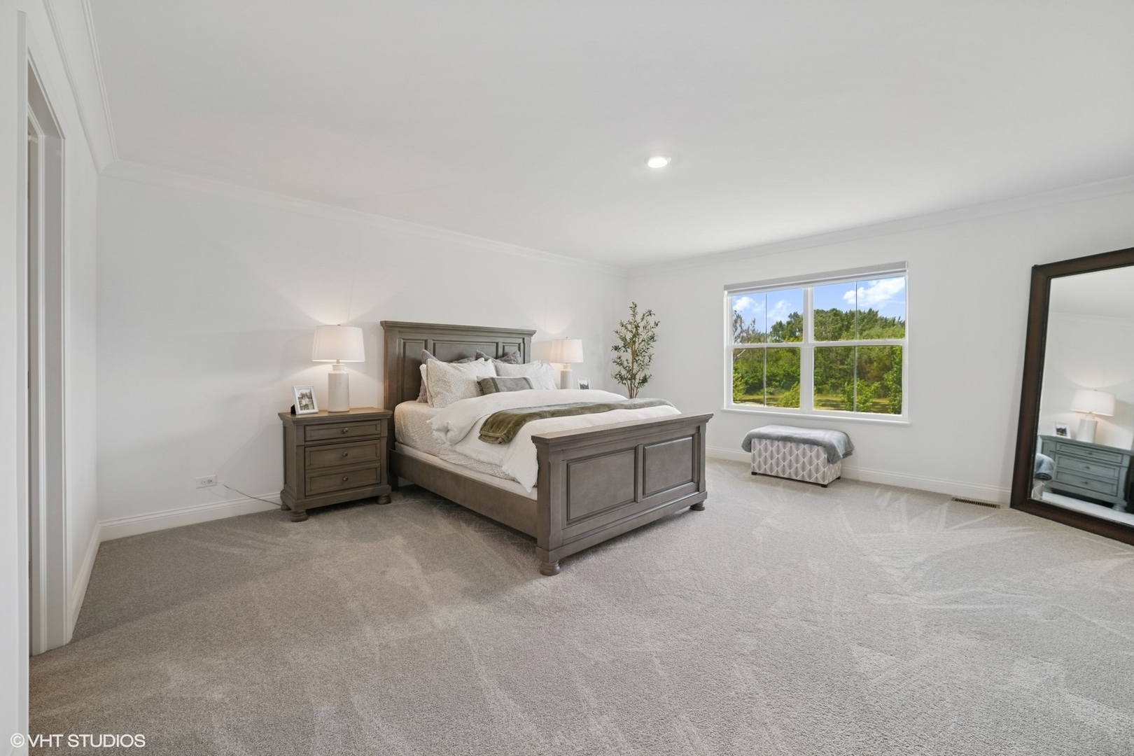 117 Hedgerow Drive Elgin, IL 60124 - Photo 11 of 26 a white bed sitting in a room next to a window