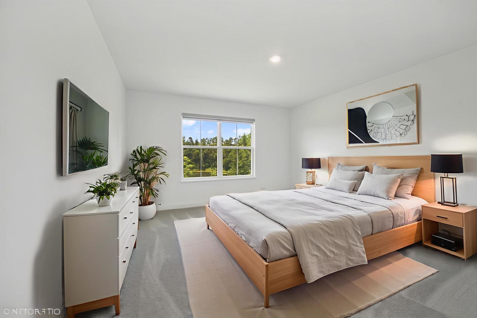 117 Hedgerow Drive Elgin, IL 60124 - Photo 15 of 26 a bedroom with a large bed and a potted plant