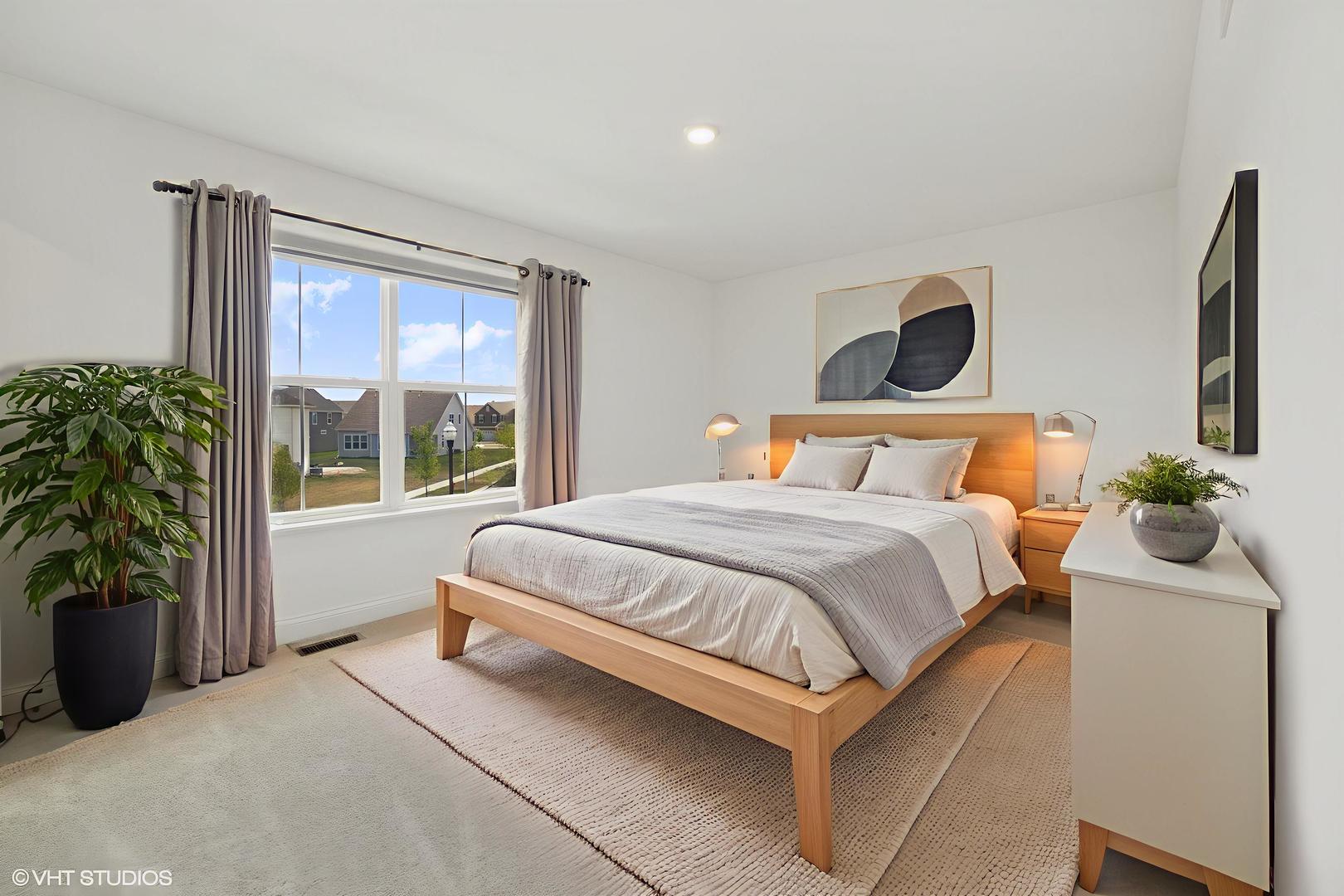 117 Hedgerow Drive Elgin, IL 60124 - Photo 17 of 26 a bedroom with a bed and a window