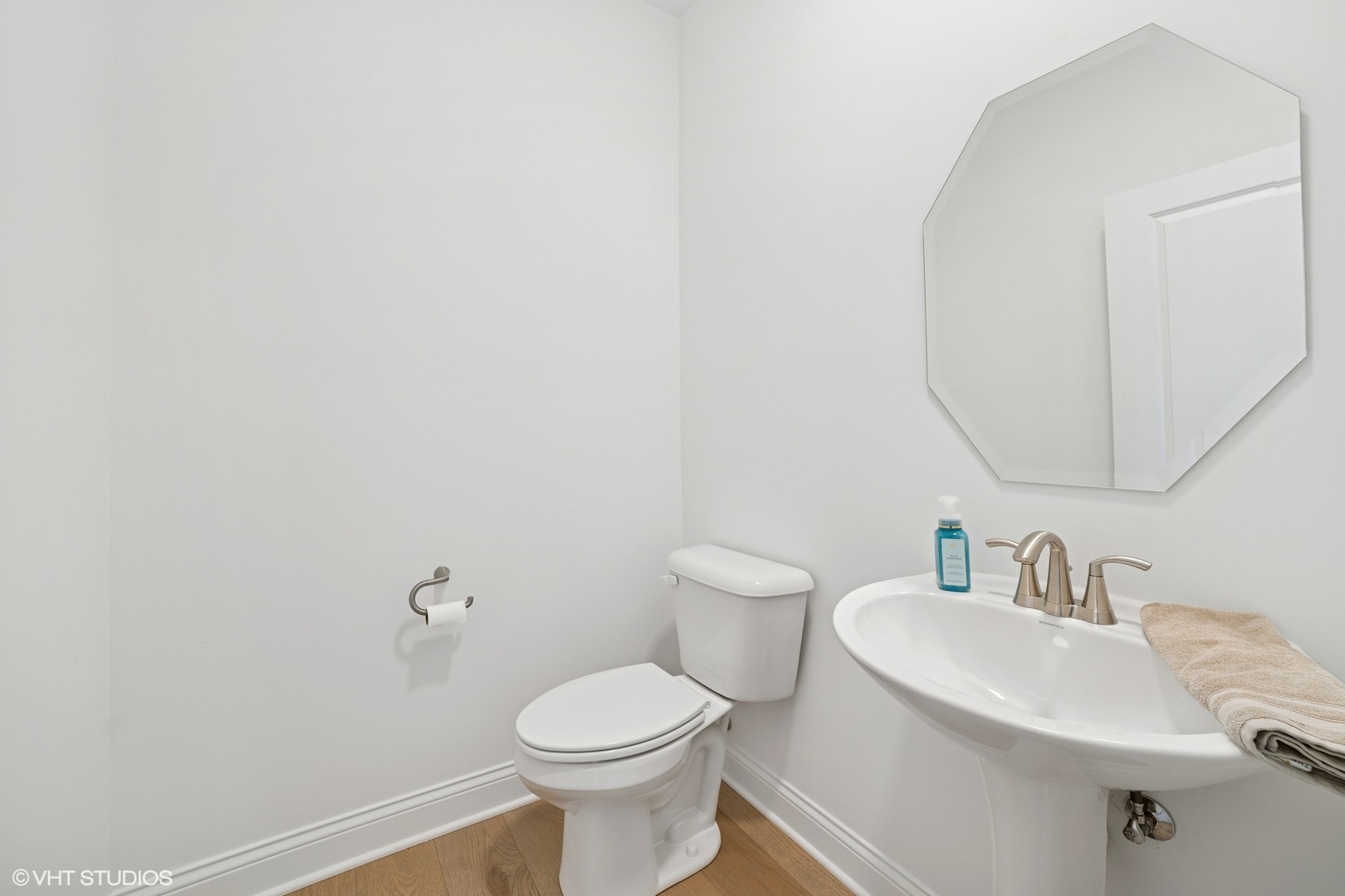 117 Hedgerow Drive Elgin, IL 60124 - Photo 4 of 26 a bathroom with a sink a toilet and mirror