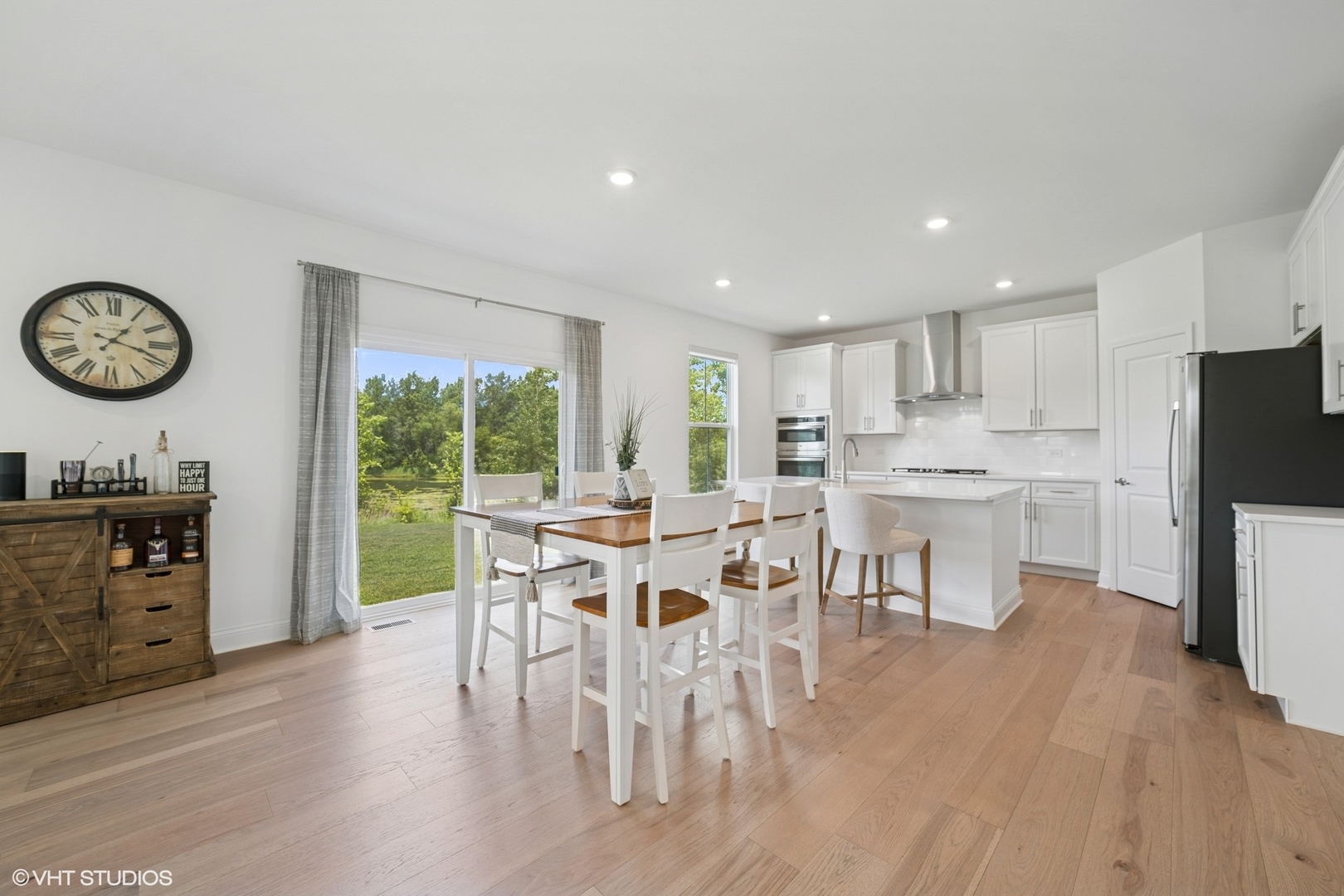 117 Hedgerow Drive Elgin, IL 60124 - Photo 5 of 26 a view of a dining room with furniture window and wooden floor