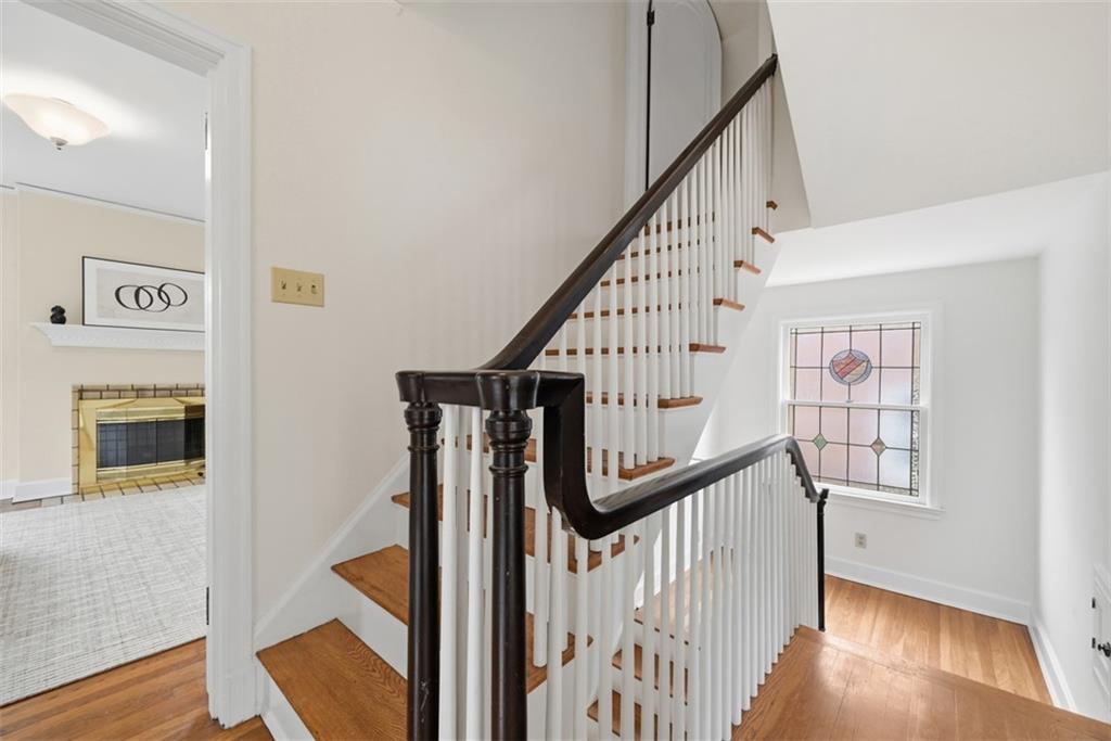 900 Wellesley Road Pittsburgh, PA 15206 - Photo 23 of 48 Upper Level Hallway looking towards the Primary Bedroom and Stairway to the Third Floor - Note the Beautiful Stained Glass Window!