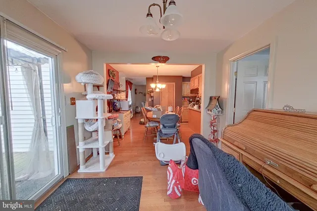 a living room with furniture gym equipment and a large window