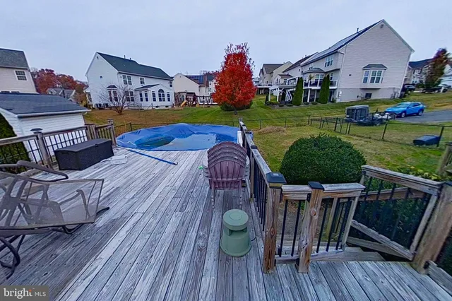 a view of a house with a big yard and a fountain