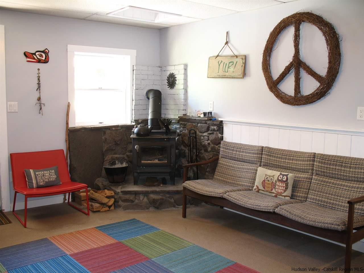985 Cold Spring Road Roxbury, NY 12474 - Photo 5 of 35 a living room with furniture and a window