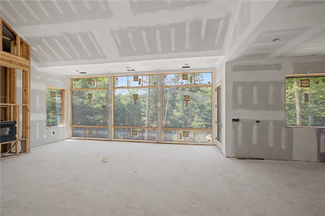 166 Ellenburg Creek Road Sunset, SC 29685 - Photo 7 of 20 Natural light floods this living area through extensive window placements, highlighting its spacious design.