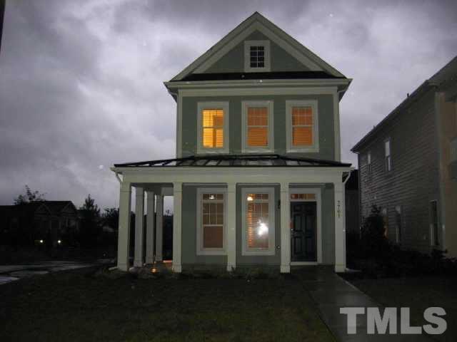 7761 Courtney Estates Drive Raleigh, NC 27617 - Photo 1 of 6 a front view of a house with a yard