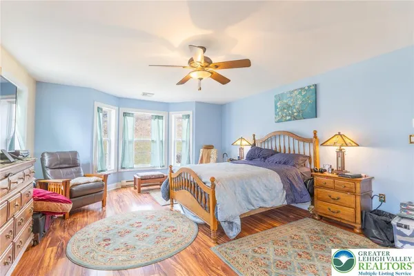 a bed room with a bed and a chandelier