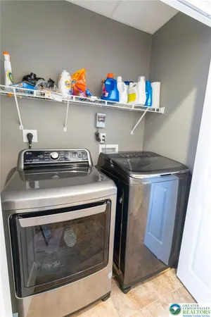 a stove top oven sitting inside of a kitchen