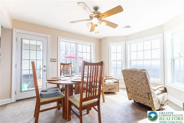 a dining room with furniture and window