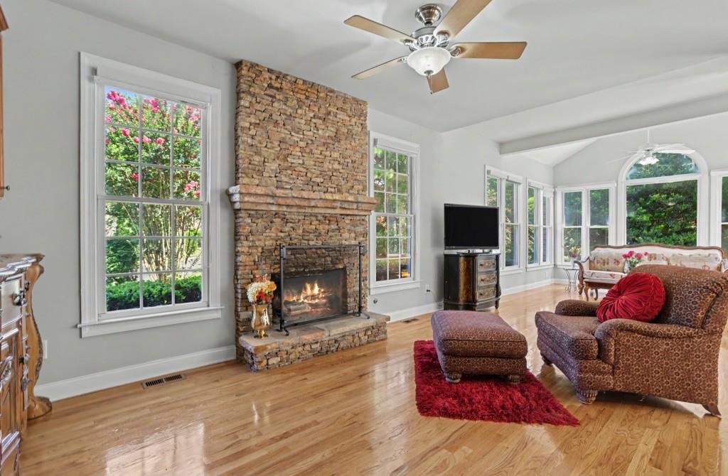 2123 Floral Ridge Drive Dacula, GA 30019 - Photo 21 of 56 a living room with furniture fireplace and flat screen tv