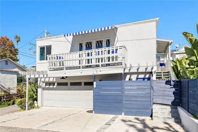 a view of a house with wooden floor and a potted plant