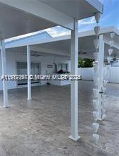 5610 Northwest 187th Street, Unit 5610 Miami Gardens, FL 33055 - Photo 6 of 7 a room with table and chairs