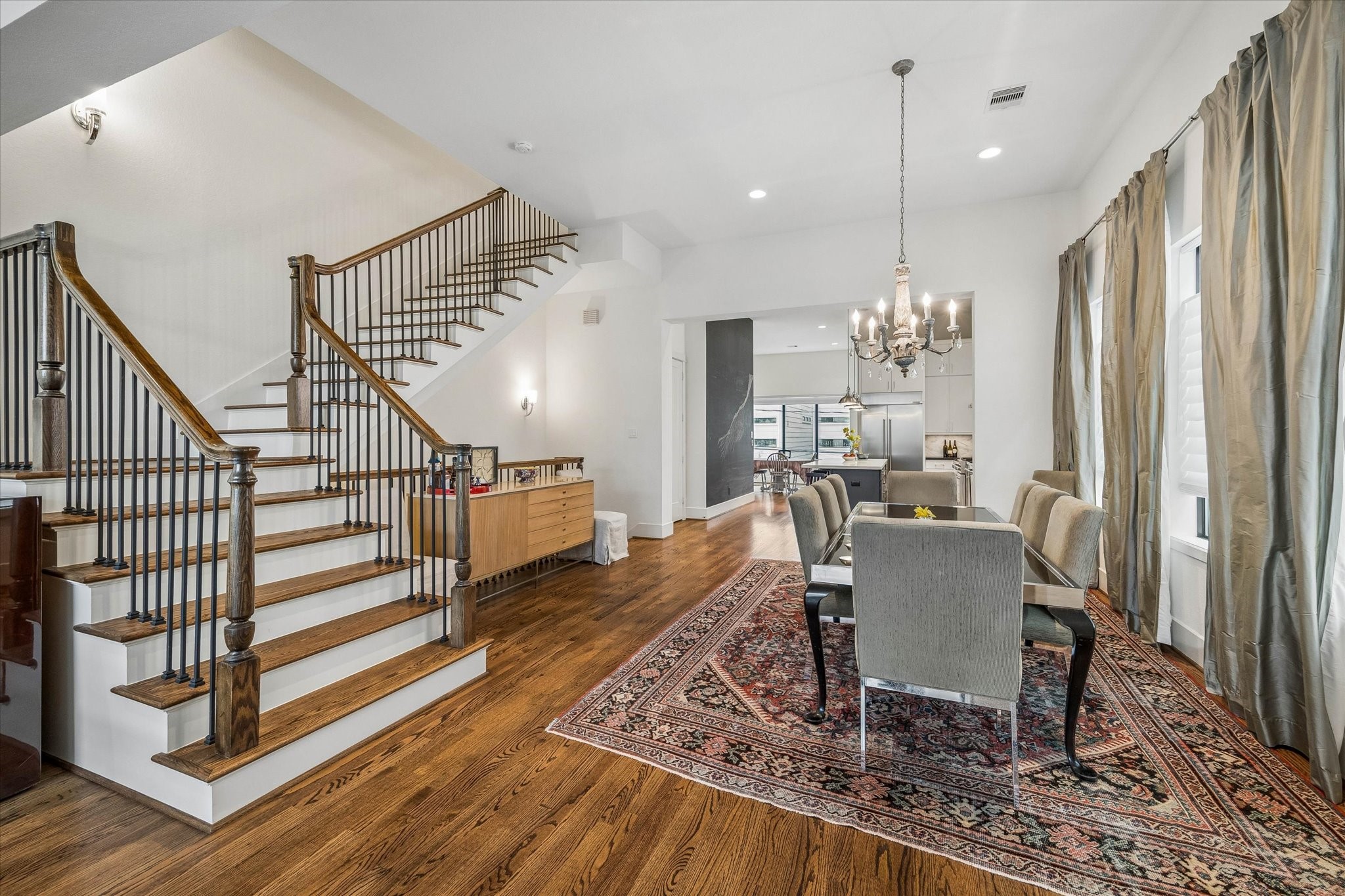 1526 Vermont Street Houston, TX 77006 - Photo 18 of 39 Dining room with soaring ceilings, rich hardwood floors, and seamless flow to the kitchen and living spaces.