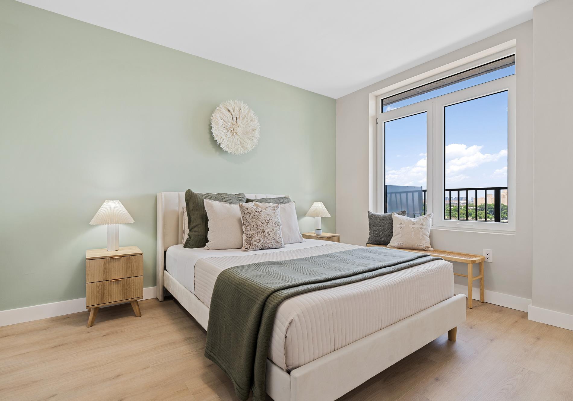 26-15 4th Street, Unit 4F Queens, NY 11102 - Photo 4 of 8 a bedroom with bed and window