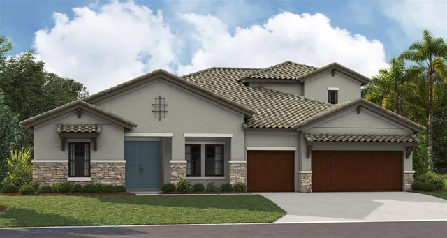 a front view of a house with a garden and yard