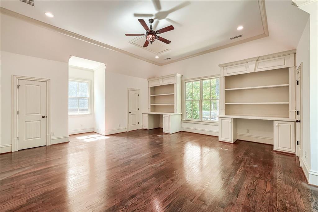 7965 Robin Road Cumming, GA 30041 - Photo 25 of 64 a view of an empty room with a window and wooden floor