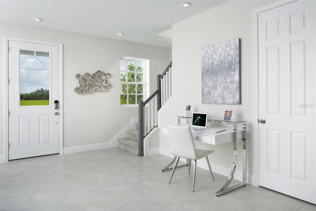 1859 Seawall Way Celebration, FL 34747 - Photo 6 of 25 a view of a livingroom with furniture and a window