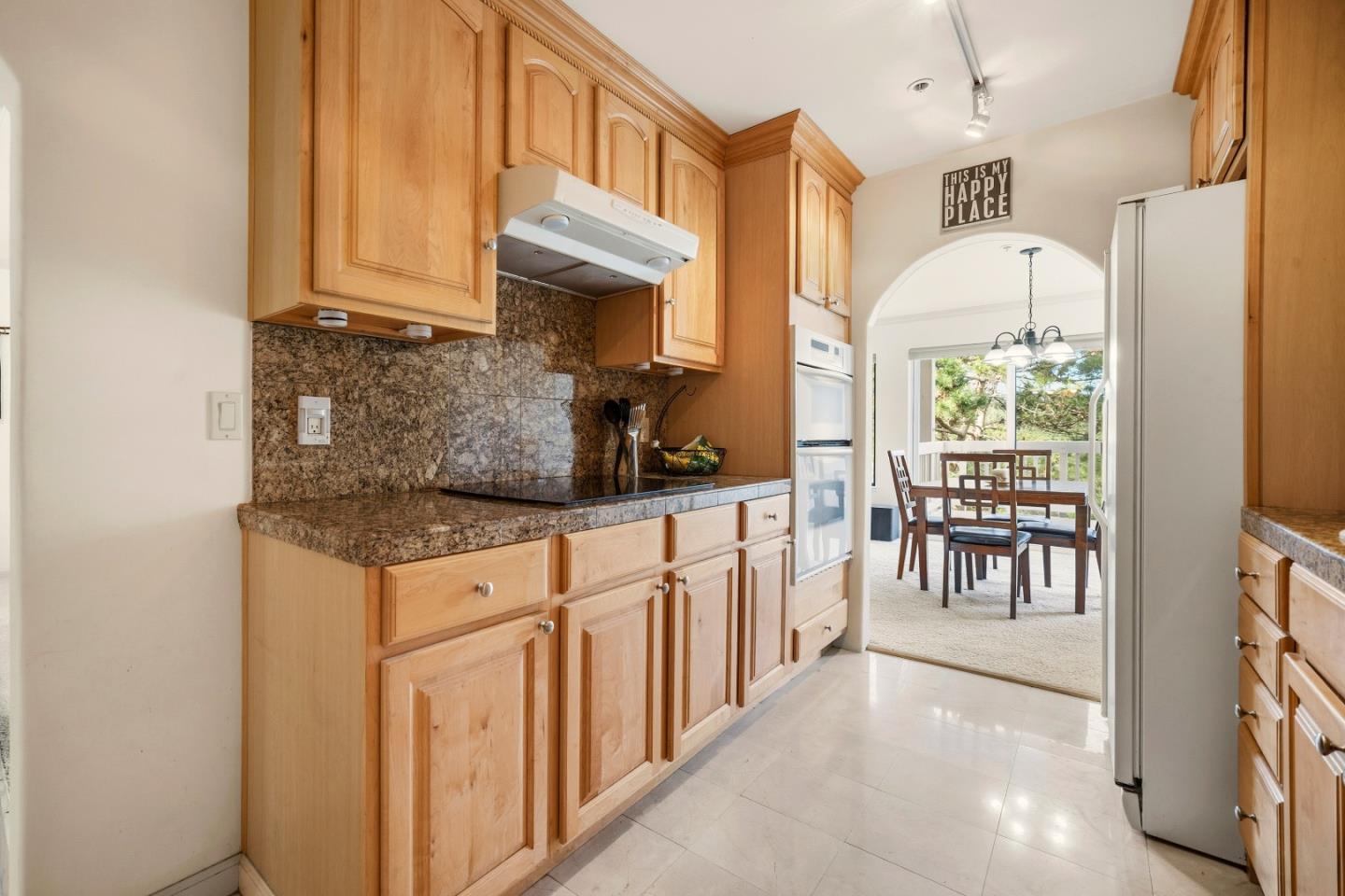 17 Shepherds Knoll Road Monterey, CA 93940 - Photo 11 of 37 a kitchen with stainless steel appliances granite countertop a stove a sink and a refrigerator