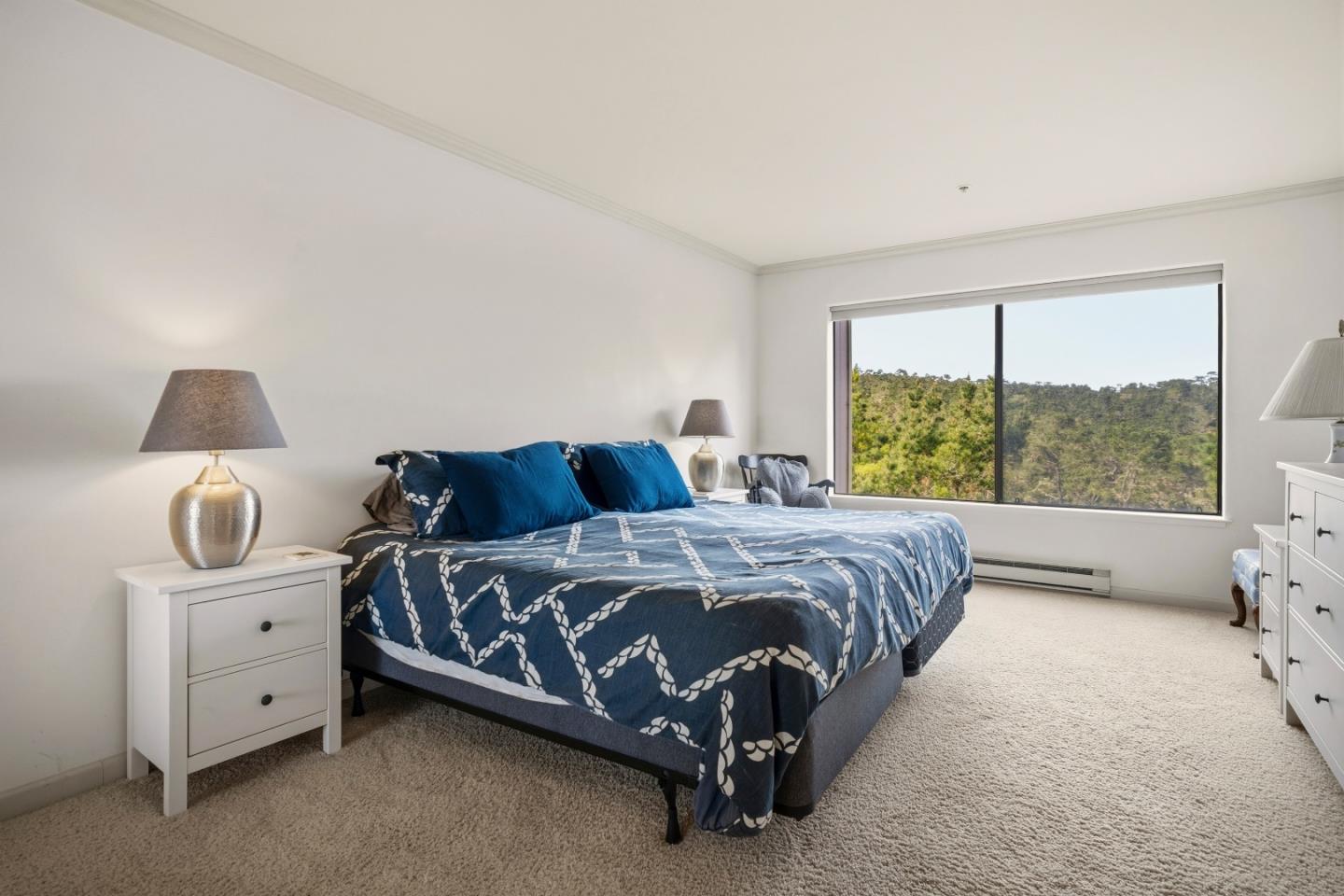 17 Shepherds Knoll Road Monterey, CA 93940 - Photo 21 of 37 a bed sitting in a bedroom next to a window