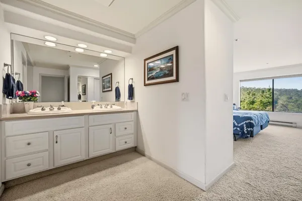 a spacious bathroom with a double vanity sink and a mirror