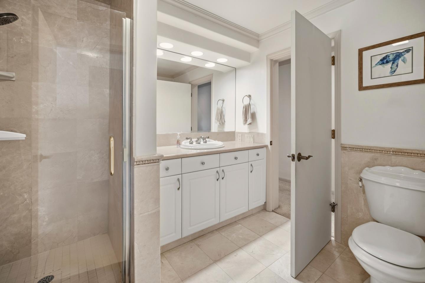 17 Shepherds Knoll Road Monterey, CA 93940 - Photo 29 of 37 a spacious bathroom with a toilet sink and a mirror