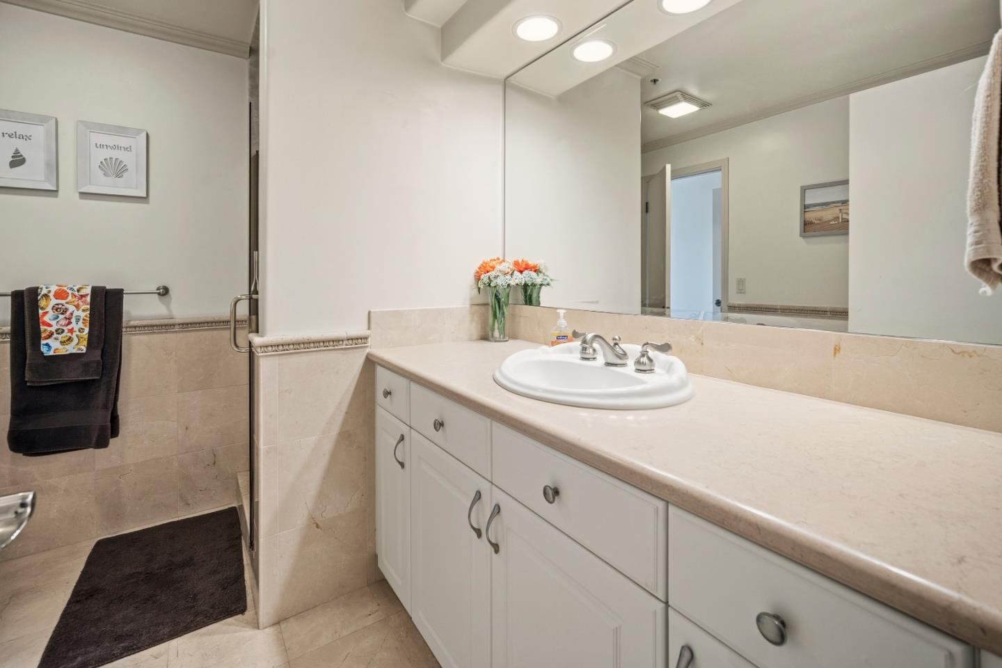 17 Shepherds Knoll Road Monterey, CA 93940 - Photo 30 of 37 a bathroom with a sink and a mirror