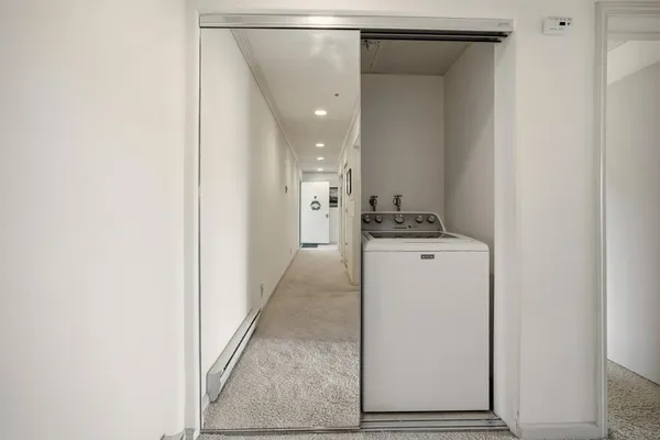 a view of hallway with washer and dryer