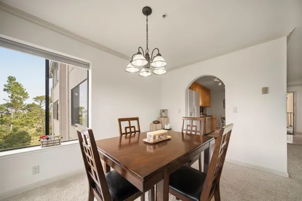 a view of a dining room with furniture window and outside view