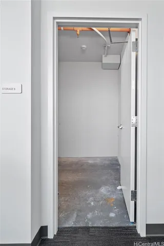 a view of walk in closet with clothes