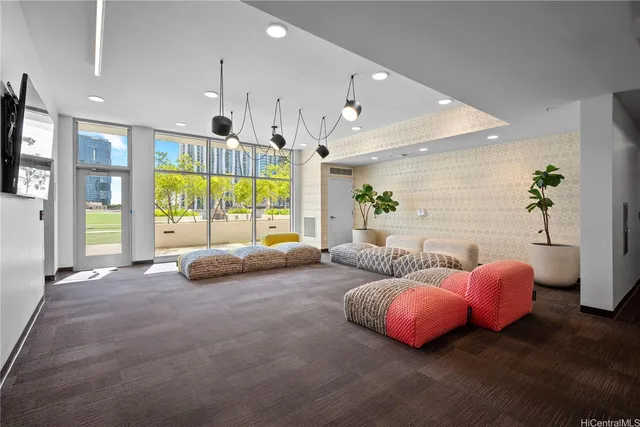 a dining room with wooden floor a glass table and chairs