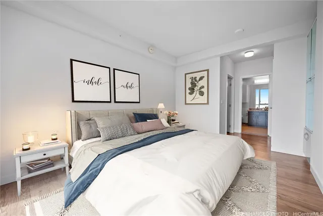 a spacious bedroom with a bed and a view of bathroom