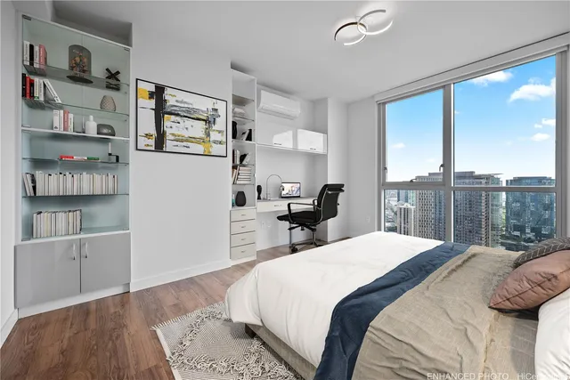 a bedroom with a large bed and a window