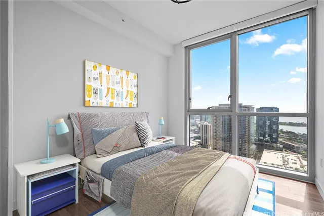 a bedroom with a large bed and a window