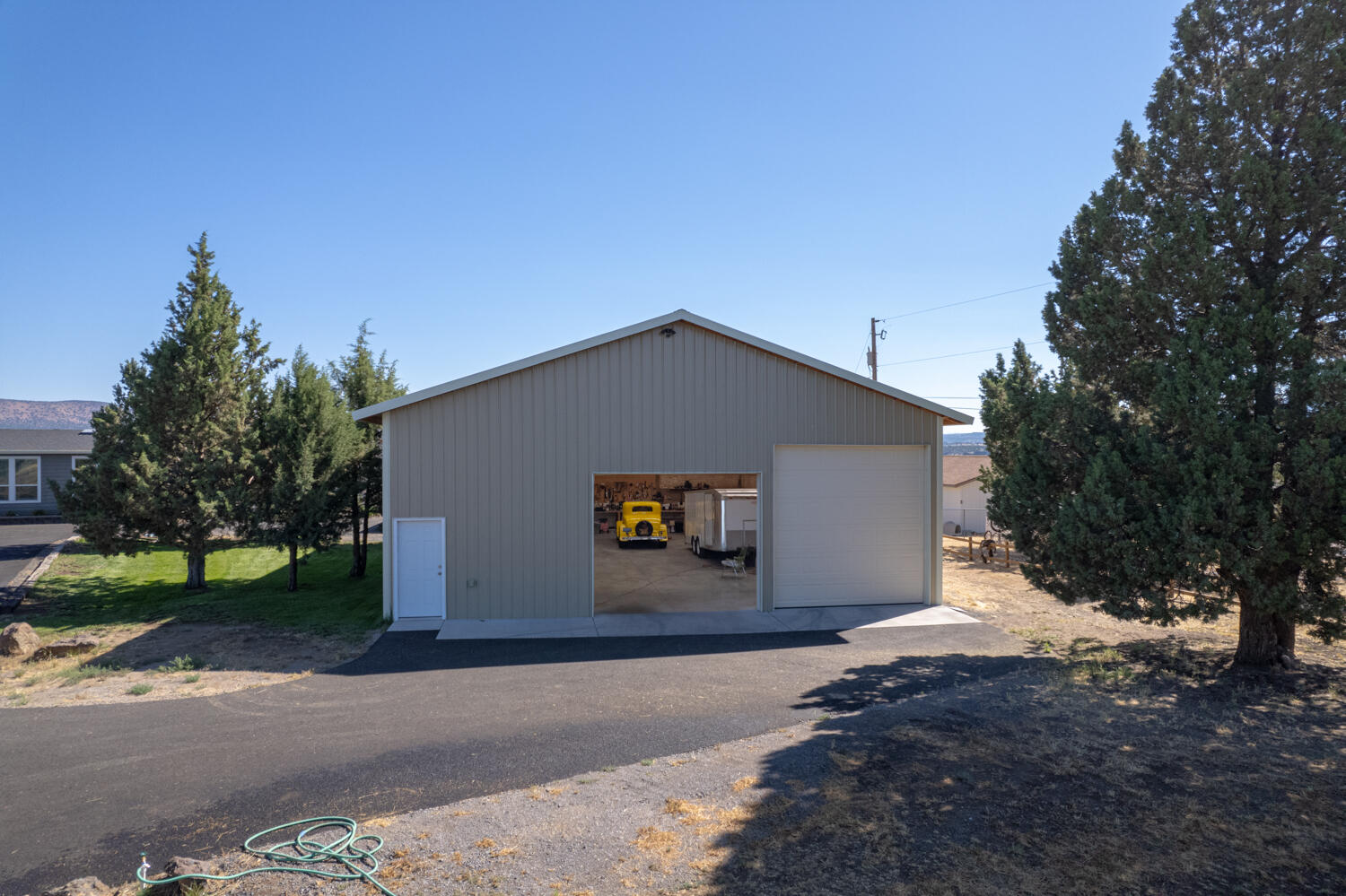 5532 Southwest Rim Road Terrebonne, OR 97760 - Photo 53 of 67 60 x 40 Fully Insulated SHOP! 14ft RV door & 10 ft door w/openers. Office & bathroom & sink.