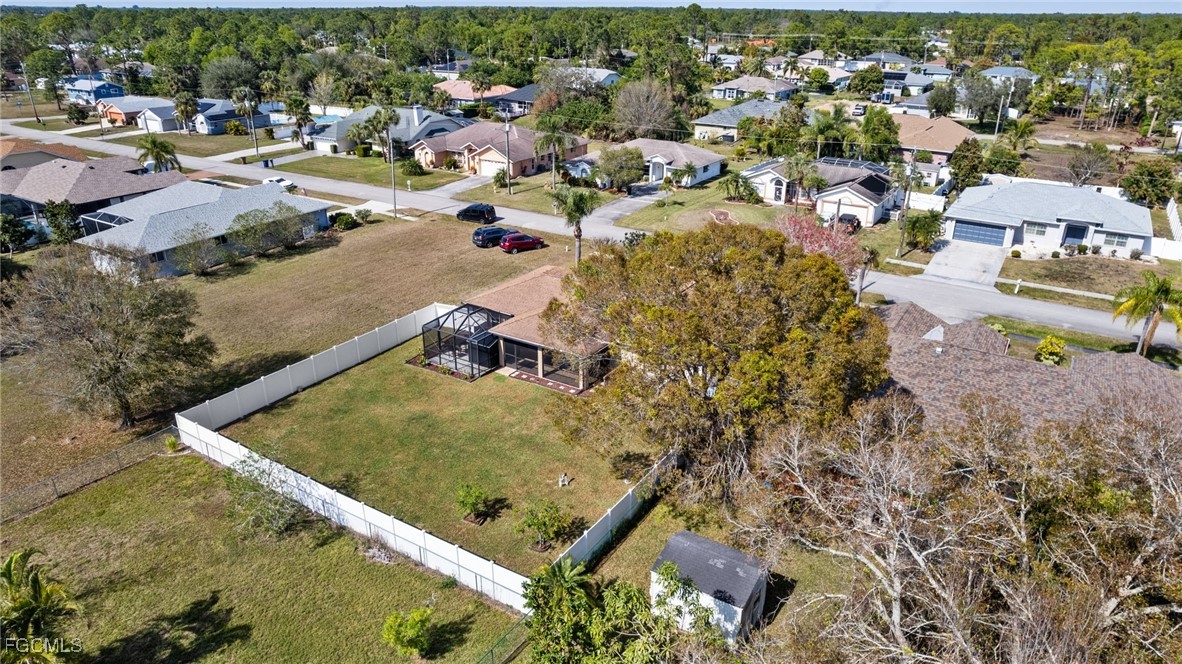 2607 8th Street West Lehigh Acres, FL 33971 - Photo 39 of 48 an aerial view of residential houses with outdoor space