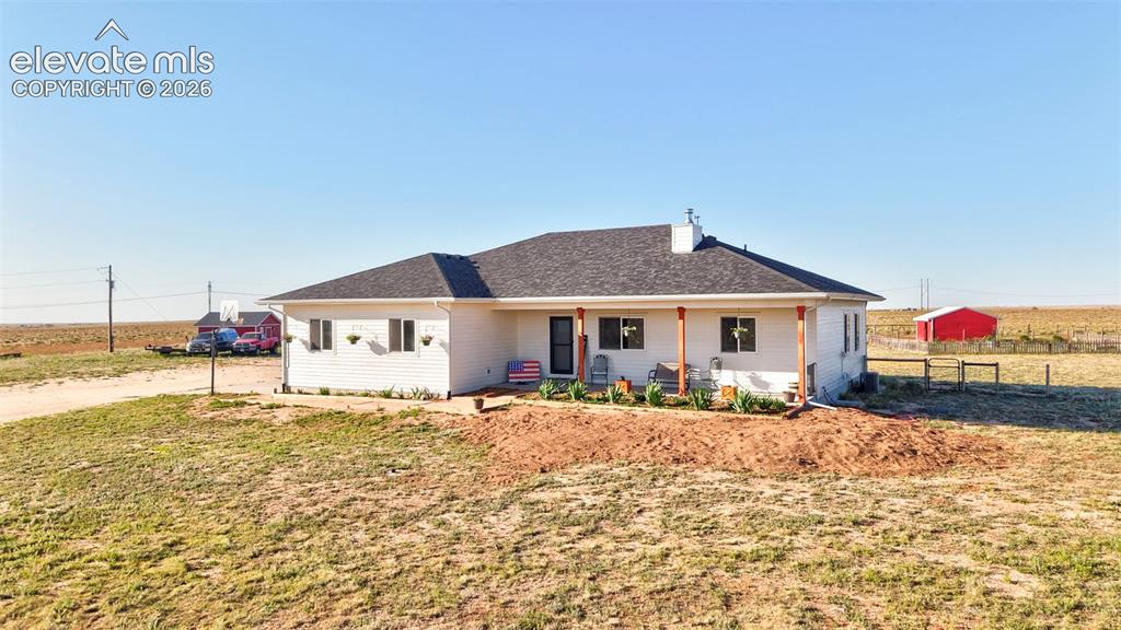 40051 Cold Iron Road Rush, CO 80833 - Photo 2 of 50 Front of Home with Covered Front Porch